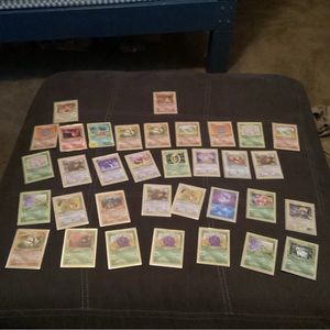 This set contains first edition cards and a Charizard 1999 this set comes with27